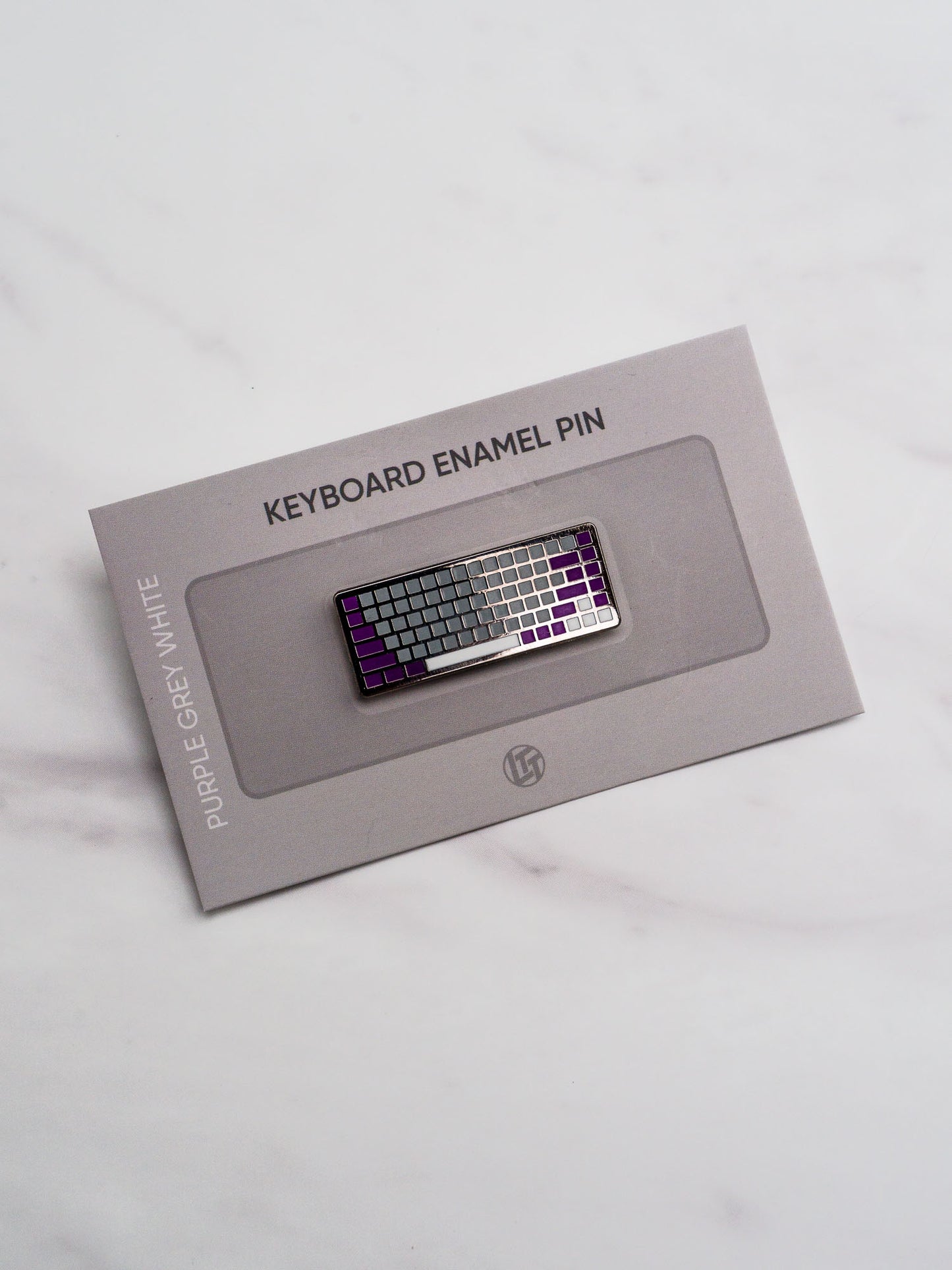 Broche de clavier bonus violet gris blanc