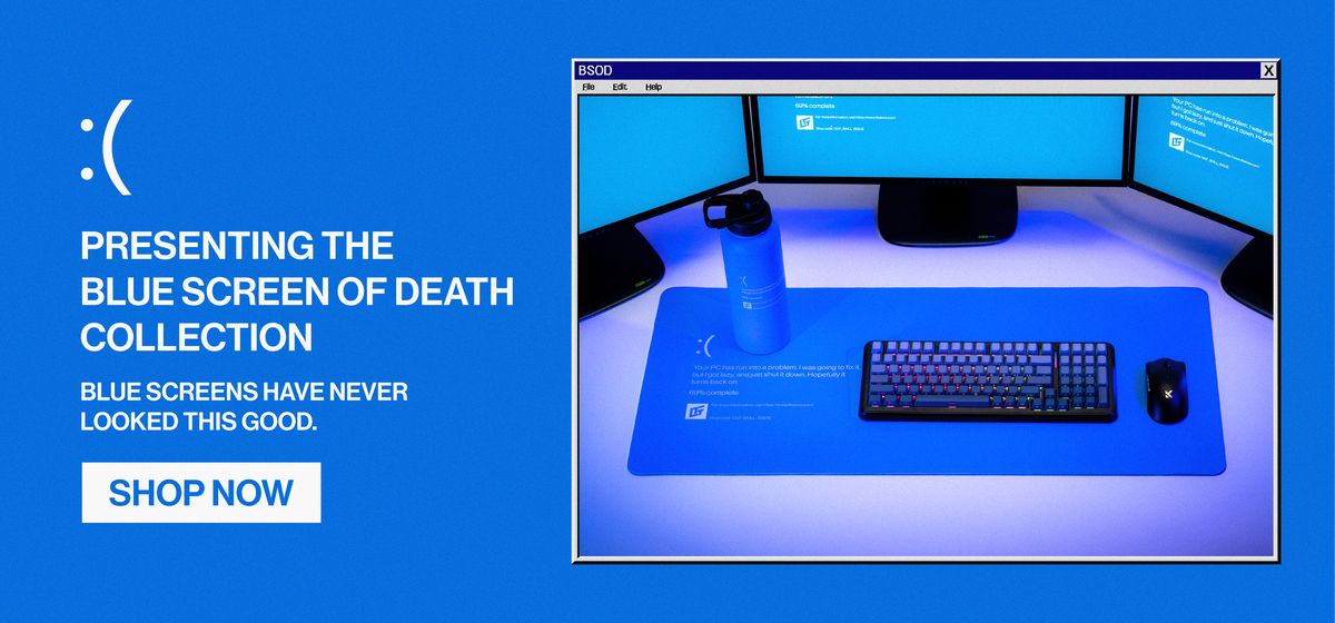Blue Screen of Death collection banner showing a blue desk setup with the Blue Screen of Death Desk Pad and Blue Screen of Dehydration Insulated Water Bottle, alongside the text “Presenting the Blue Screen of Death Collection. Blue screens have never looked this good.”